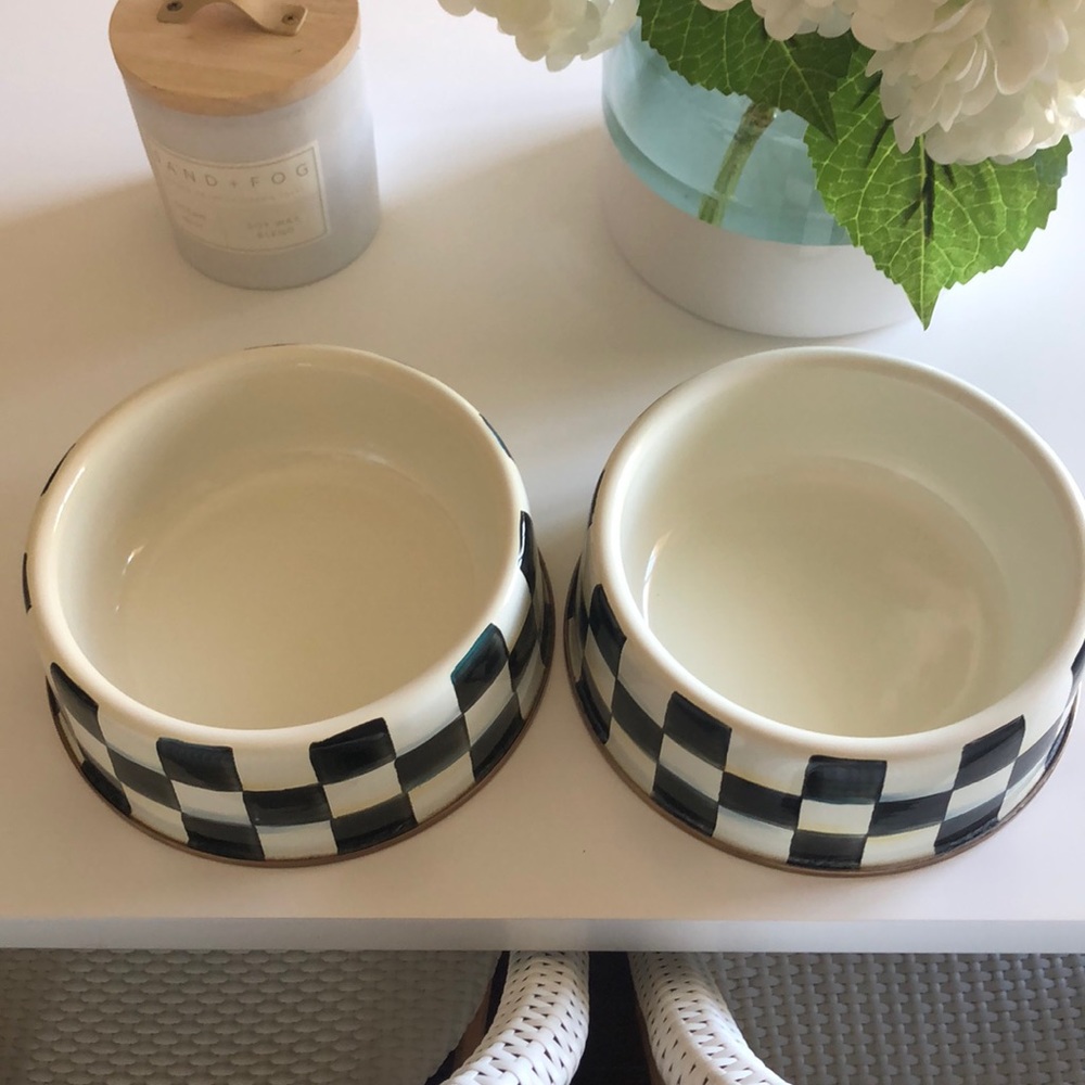 Two large Mackenzie Childs dog bowls